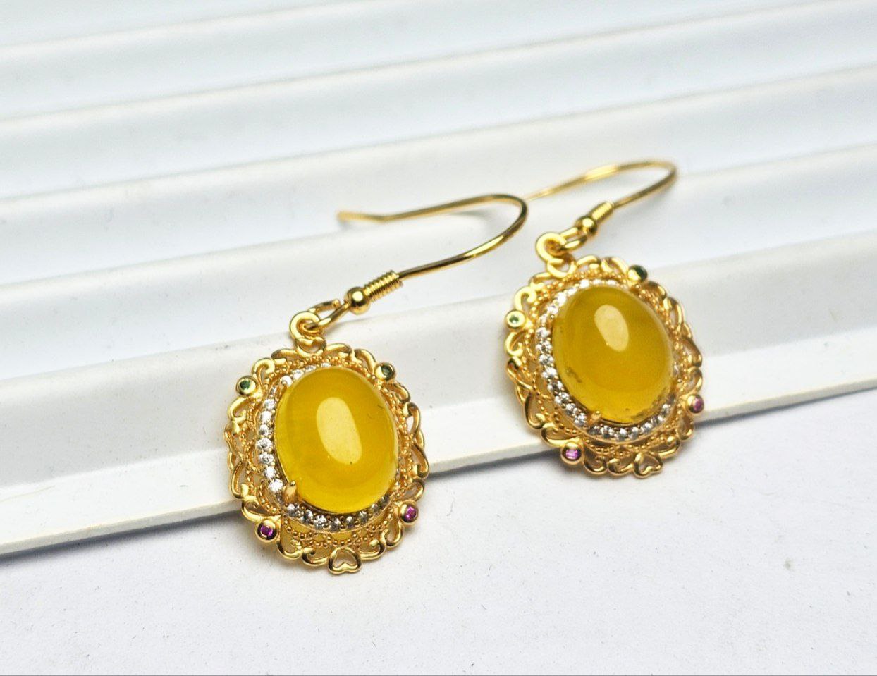 گوشواره نقره عقیق زرد شرف شمس گوشواره نقره عقیق زرد شرف شمس